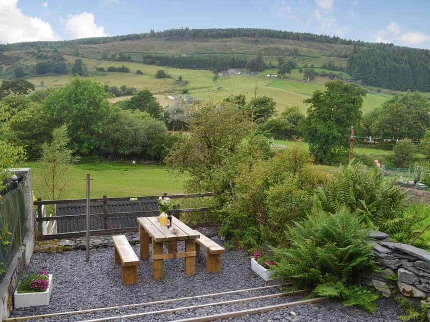 Sitting out area with lovely countryside views | Bwthyn Pabi, Penmachno, near Betws-Y-Coed