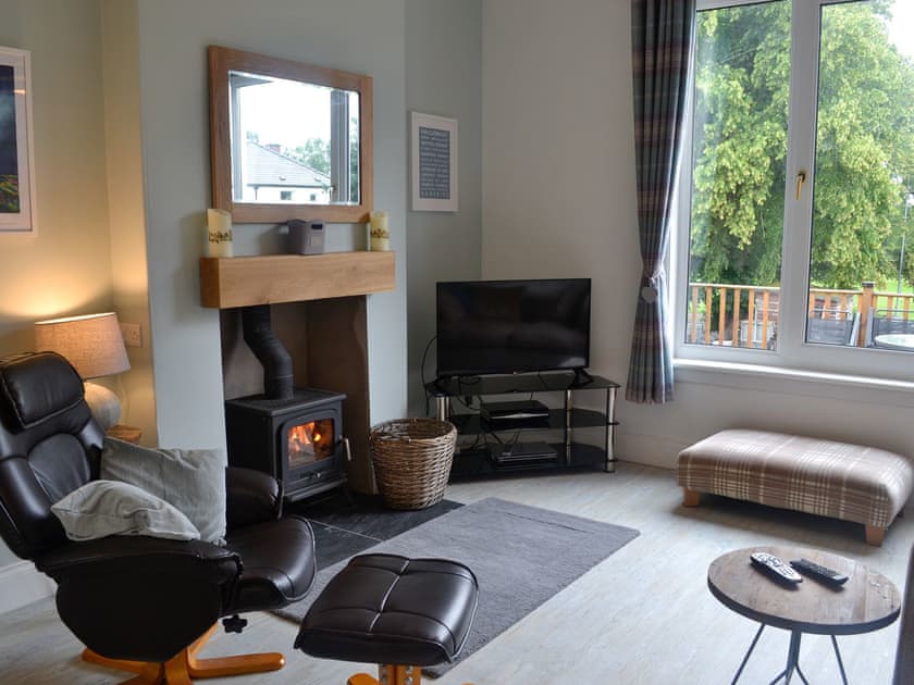 Living room with wood burner | Violet Grove, Castle Douglas
