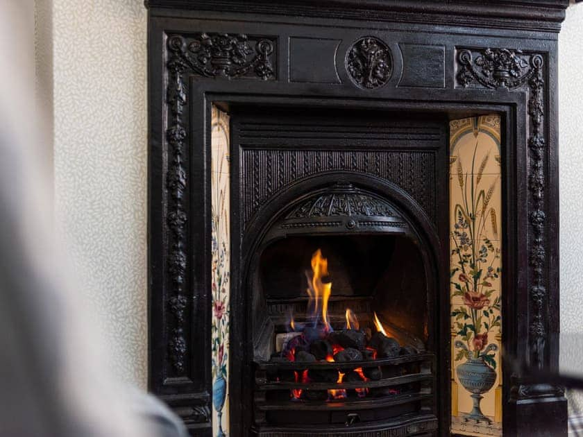 Relax by the fire in the lovely living room | Shrewsbury Fields, Shifnal