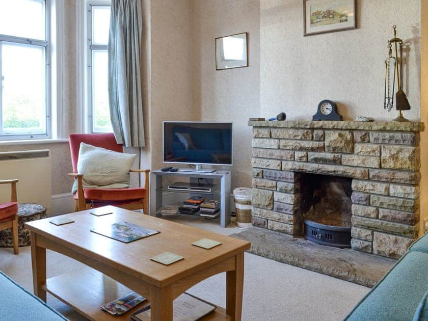 Welcoming living room with open fire | The Castaway, Mundesley