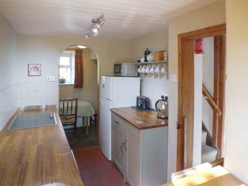 Well-equipped galley-style kitchen | Gable Cottage, Onecote, near Leek