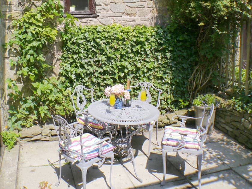 Enclosed courtyard with outdoor furniture | Gable Cottage, Onecote, near Leek