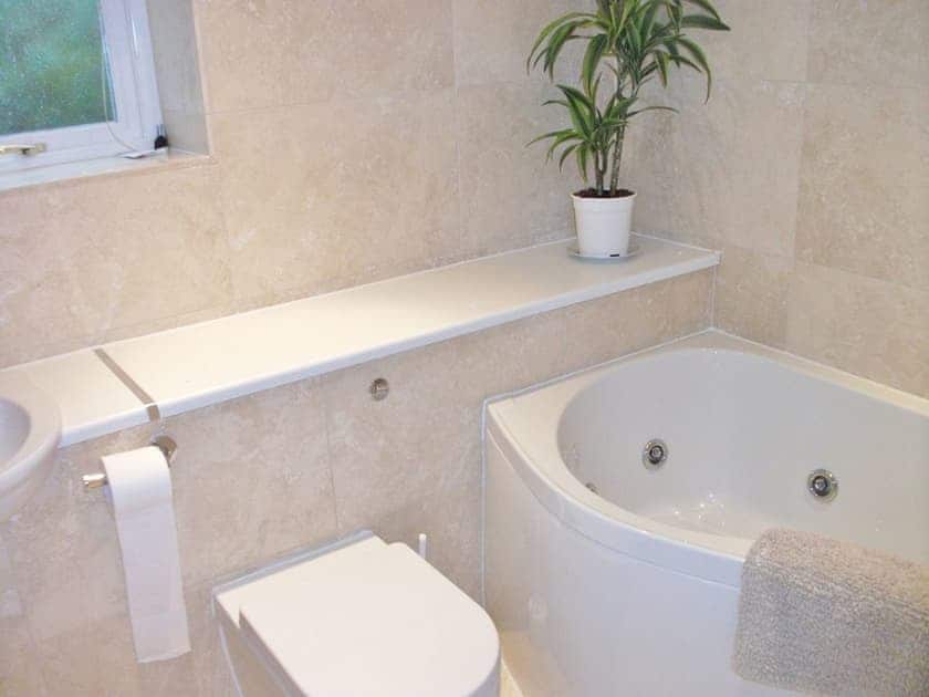 Modern family bathroom iwith Jacuzzi bath and under floor heating | Watch House, Fowey