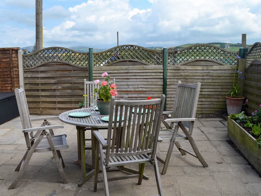 Enclosed rear courtyard with garden furniture | Morolwg, Borth, near Aberystwyth