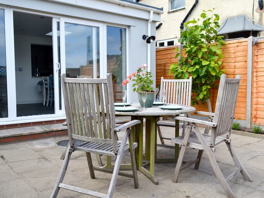 Enclosed rear courtyard with garden furniture | Morolwg, Borth, near Aberystwyth