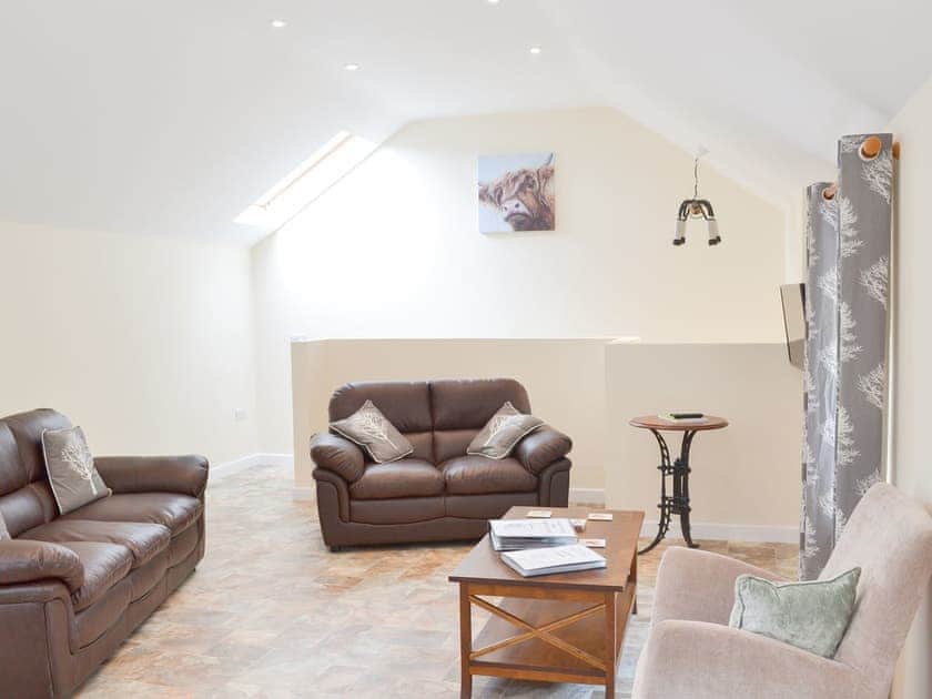 Comfortable living area with quirky lighting | Scrumpy Barn - Hayes Farm Mews, Luton, near Newton Abbot