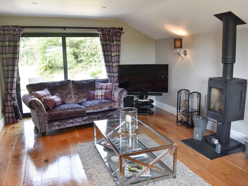 Living room with wood burner | Elleray Cottage, Windermere