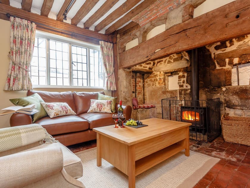 Living room with wood burner | Pollard Cottage, Lingfield