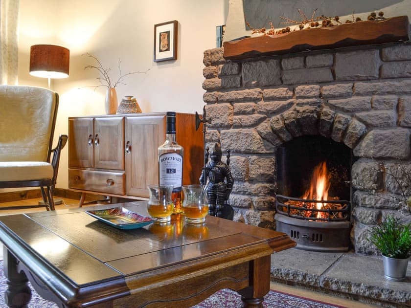 Cosy living room with open fire | Haagwood Cottage, Kilberry, near Tarbert