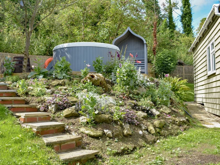 Delightful garden with hot tub | Culver Chalet, Bembridge, near Sandown