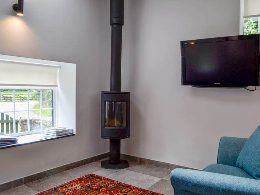 Cosy and welcoming living area | Bwythn Y Saer, Plas Cilybebyll, near Pontardawe