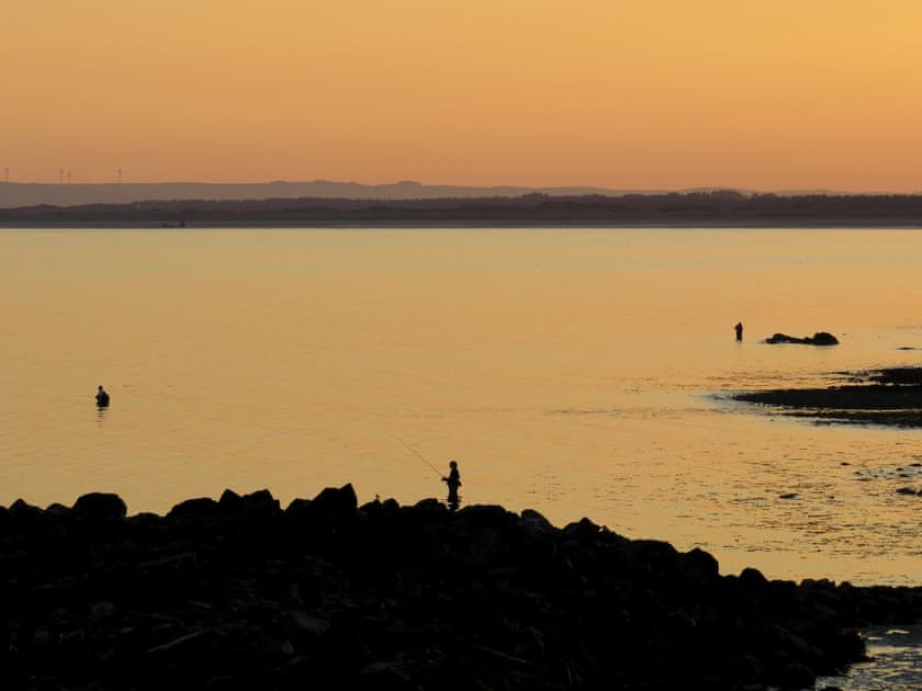 Fishing at sunset in the bay at the front of the cottage | Fisherman’s Cottage, Stairhaven by Glenluce