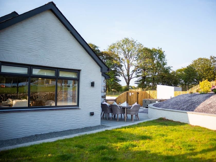 Outdoor lawned area and paved patio with furniture | Stabl, Bethania, near Aberaeron