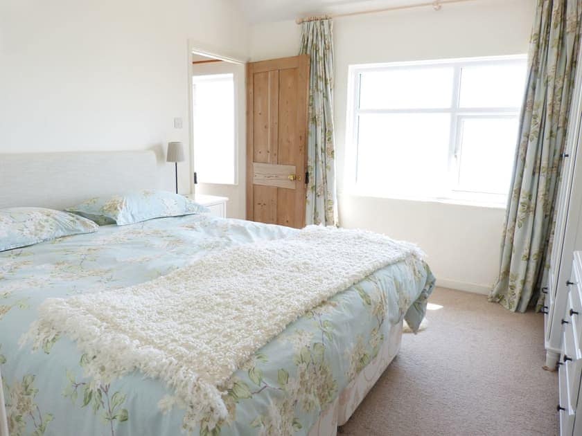 Relaxing bedroom with kingsize bed | Coastguard Cottage, Sandown
