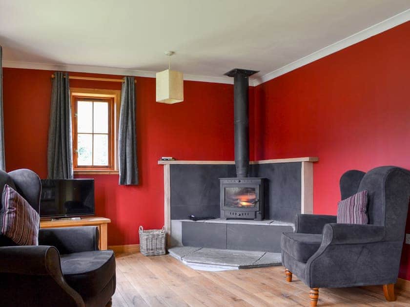 Comfortable living room with wood burner | Loch Long View, Dornie