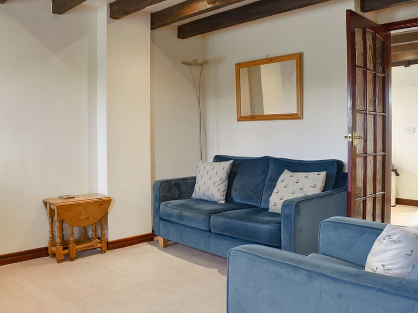 Living room with beamed ceiling | Black Bull Cottage, Ugthorpe, near Whitby