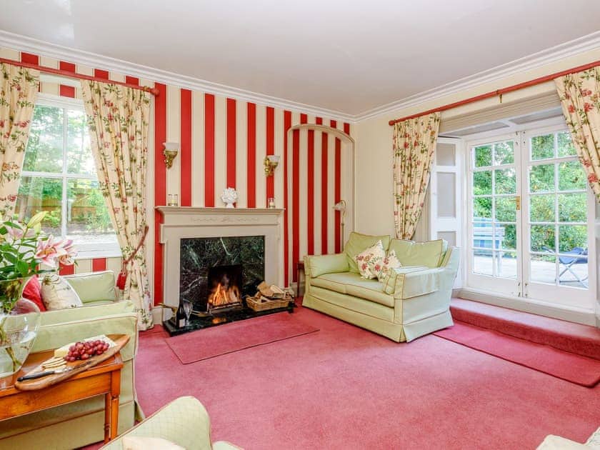 Comfortable living room with an open fire | Braydeston House, Brundall, near Norwich