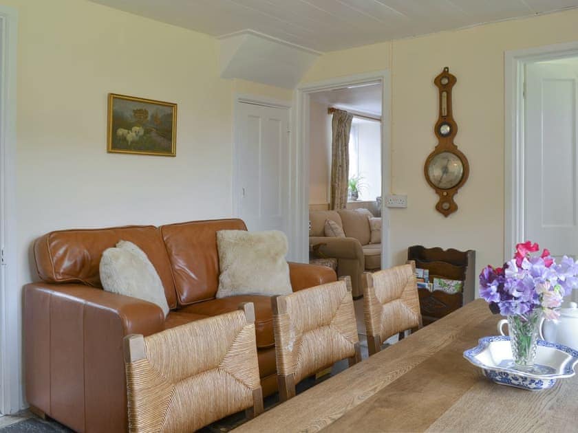 Comfortable seating area within the dining room | Winscott Cottage, Holsworthy, near Bude