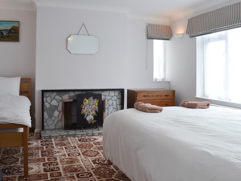 Large bedroom with fireplace | West Middlewick Farm - The Old Creamery - West Middlewick Farm , Nomansland, near Tiverton