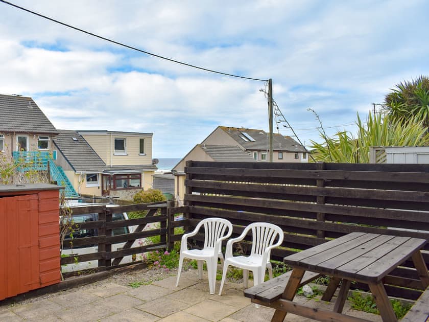 Patio with sea views | Barbara Anne’s - Porthtowan Holiday Apartments, Porthtowan, near Truro