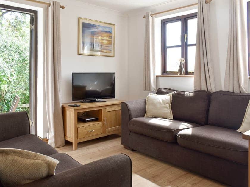 Welcoming living and dining room | Prince Croft Cottage - Mount Hawke Holiday Bungalows, Mount Hawke, near Redruth