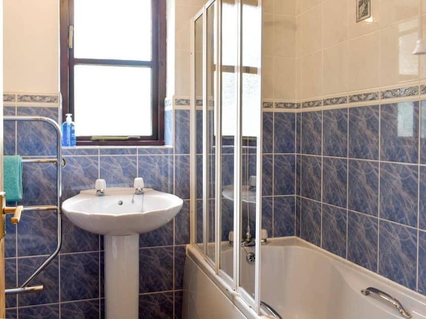 Family bathroom with shower over bath | Prince Croft Cottage - Mount Hawke Holiday Bungalows, Mount Hawke, near Redruth