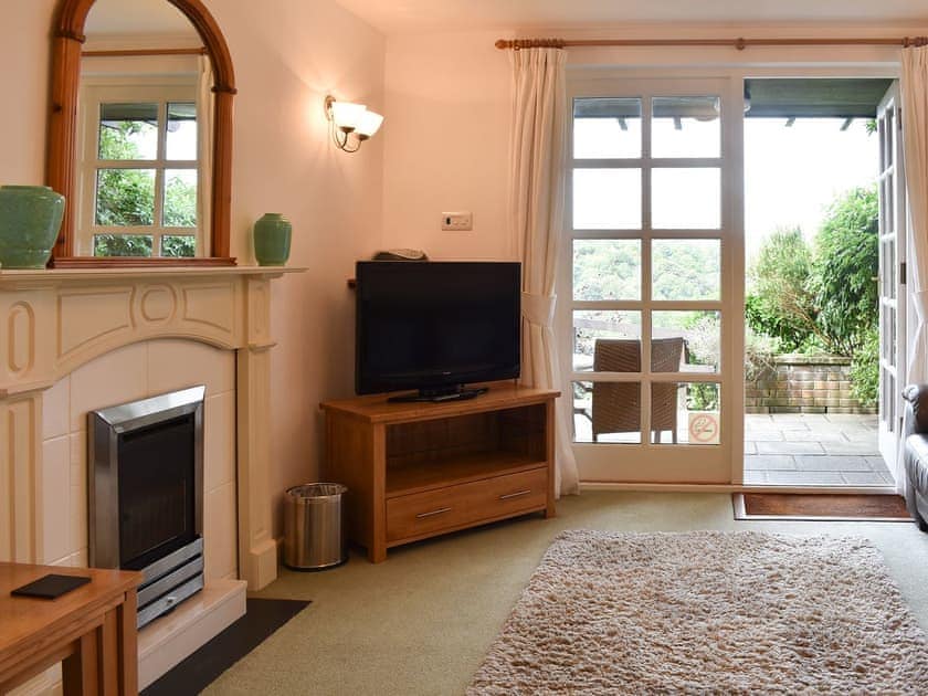 Cosy living room with patio access | Little Larnick, Looe