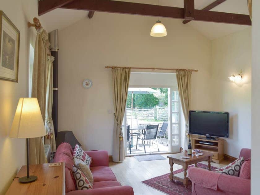 Spacious living area with exposed wood beams | Cothi Cottage - Upton Hall Cottages, Nantgaredig, near Llandeilo