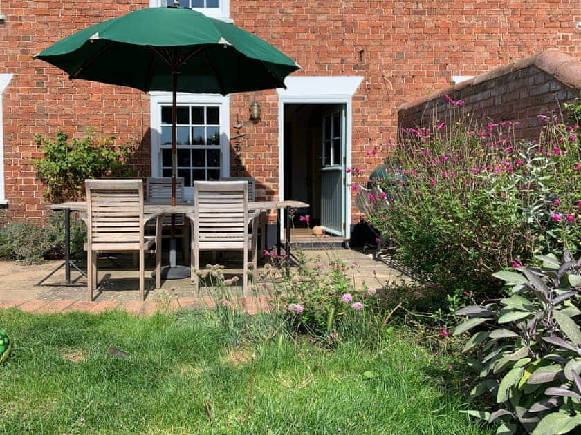 Front garden and patio area | Coastguard’s Cottage, Burnham Overy Staithe, near Burnham Market