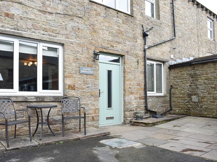 Lovely paved patio area with table and chairs | 3 Winville Mews, Askrigg, near Hawes
