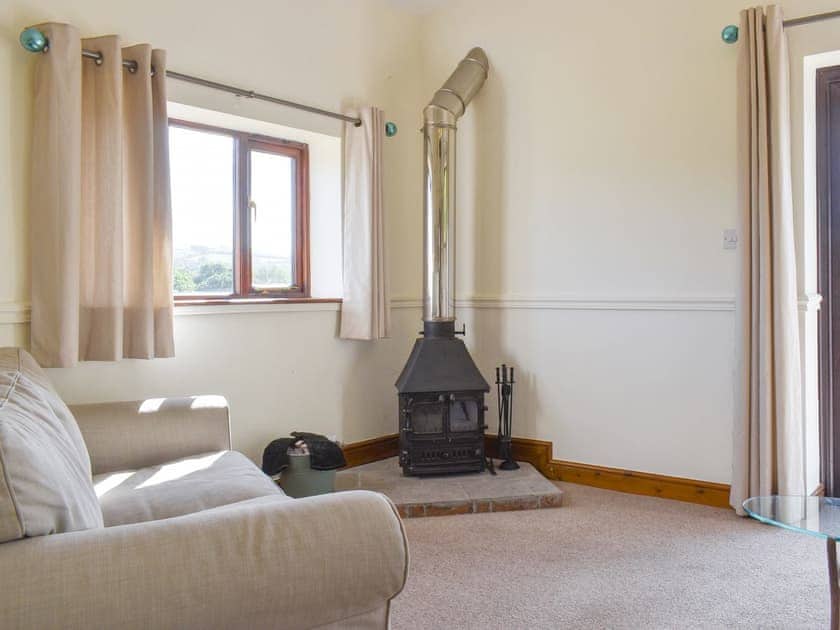 Welcoming living area with wood burner | The Old Dairy, Thorncombe, near Broadwindsor