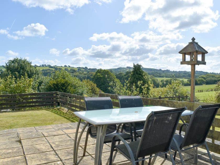 Paved patio area with outdoor furniture | The Old Dairy, Thorncombe, near Broadwindsor