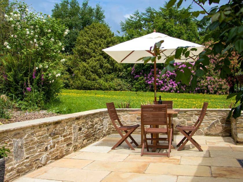Patio with garden furniture and barbecue | The Linney - Cartole Cottages, Pelynt, near Looe