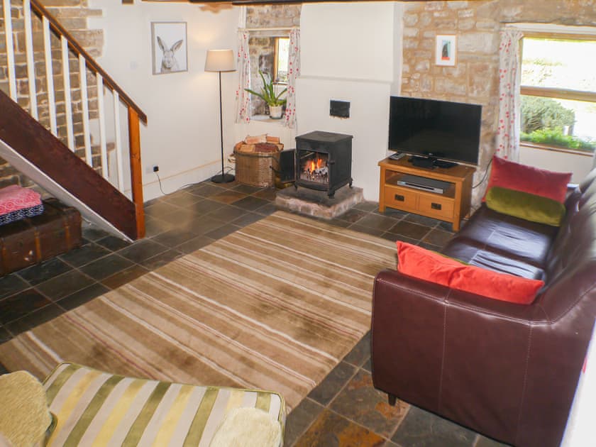 Comfortable and cosy flag-floored living room | Garden Cottage, Onecote, near Leek