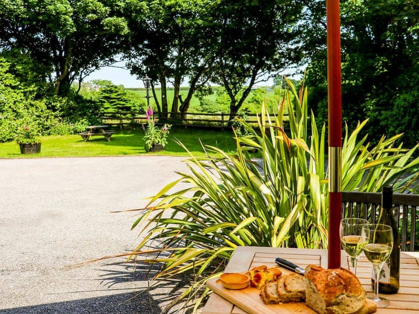 Patio with garden furniture and barbecue | The Old Stable  - Cartole Cottages, Pelynt, near Looe