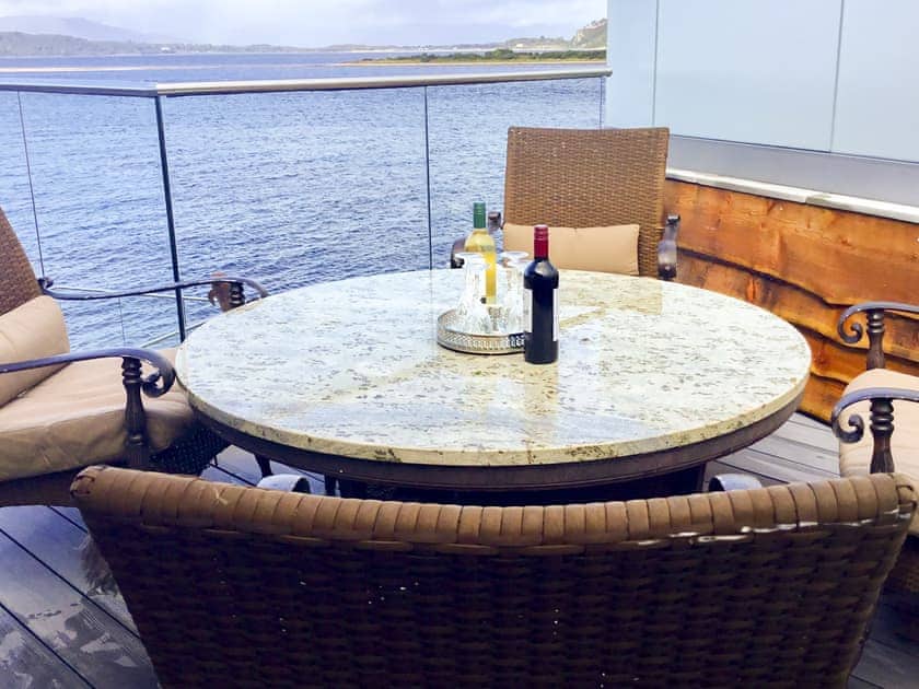 Large decked area with garden furniture | Otters View, Connel, near Oban