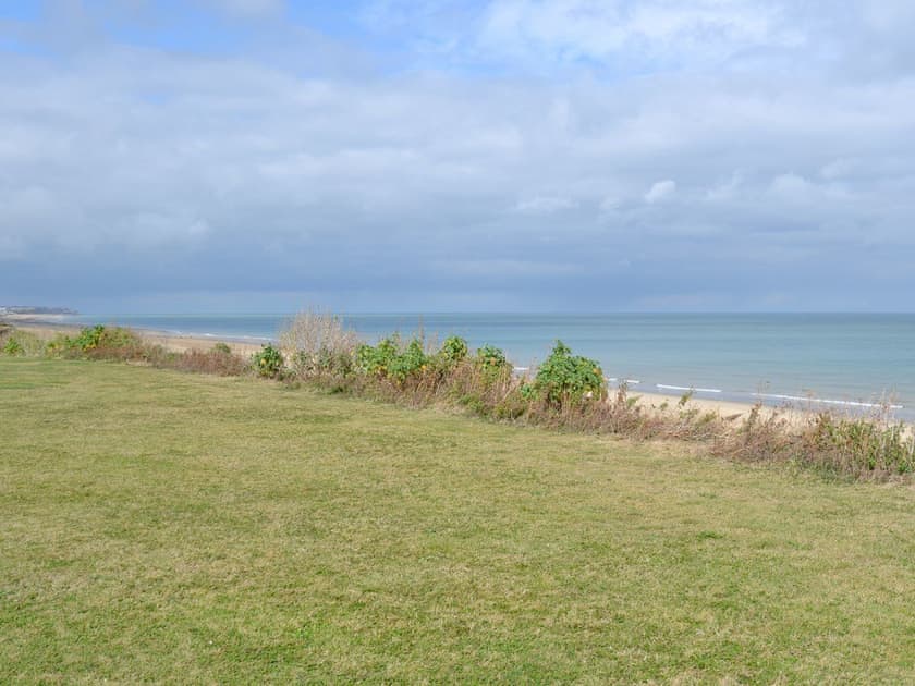 The grassed clifftops offer a commanding view of the coastline | Tamarisk, Walcott