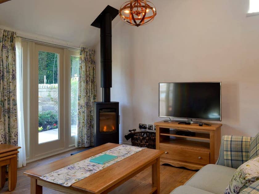 Cosy living area with wood burner | Pear Tree Cottage, Harwood Dale, near Scarborough