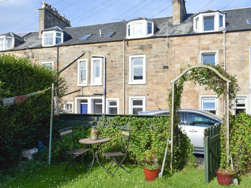Enclosed garden area and front of the holiday home | Reflections, St Monans, near Anstruther