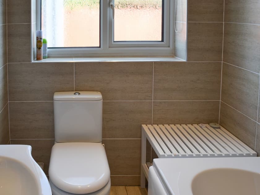 Homely bathroom with shower over the bath | Grays Cottage, Bridlington