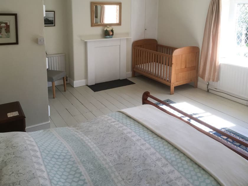 Large double bedroom with full-size cot | Park House, Harlaxton, near Grantham