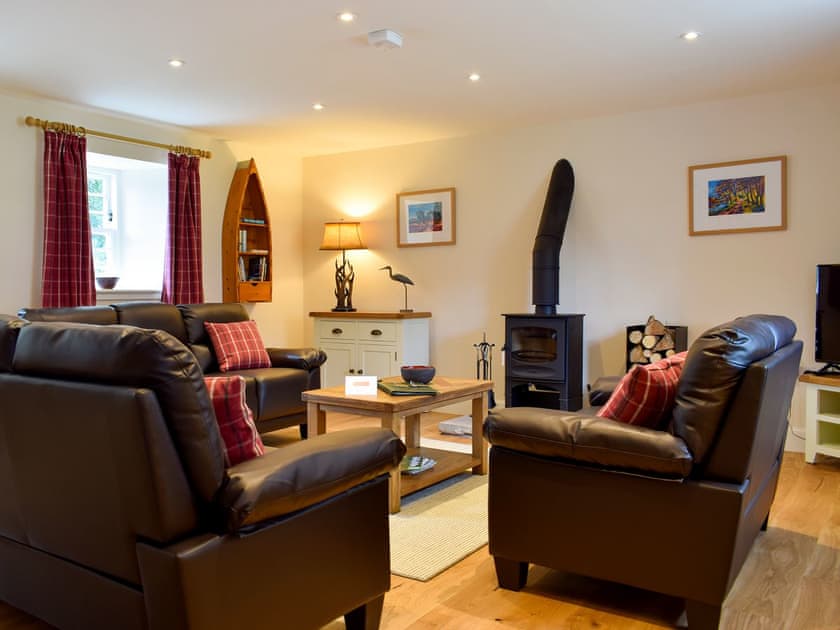 Comfortable living room with wood burner | Brandoch Lodge - Kinnaird Estate Cottages, By Dunkeld, Pitlochry