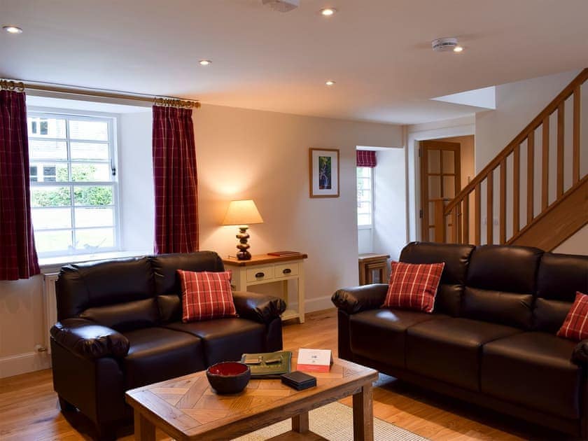 Comfortable living room with wood burner | Brandoch Lodge - Kinnaird Estate Cottages, By Dunkeld, Pitlochry