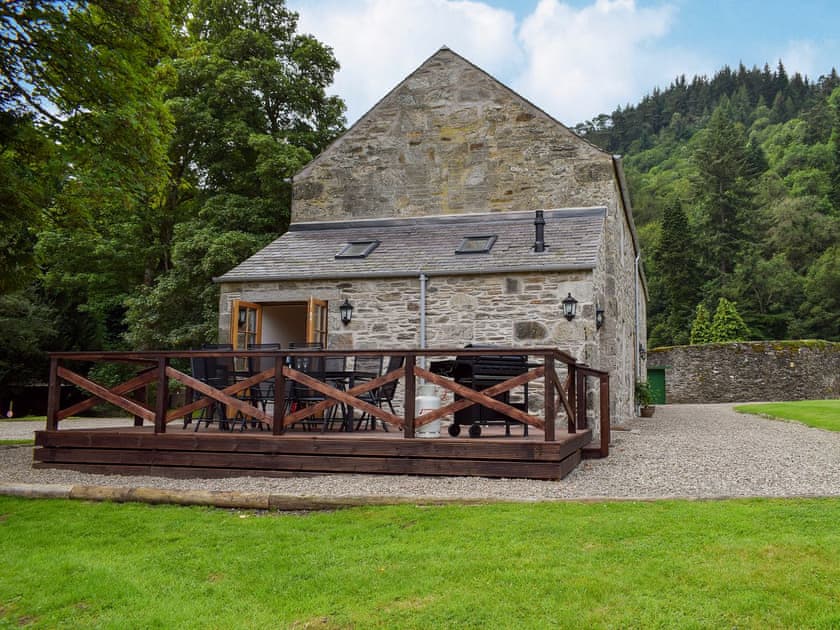 Decked area with garden furniture and gas BBQ | Brandoch Lodge - Kinnaird Estate Cottages, By Dunkeld, Pitlochry