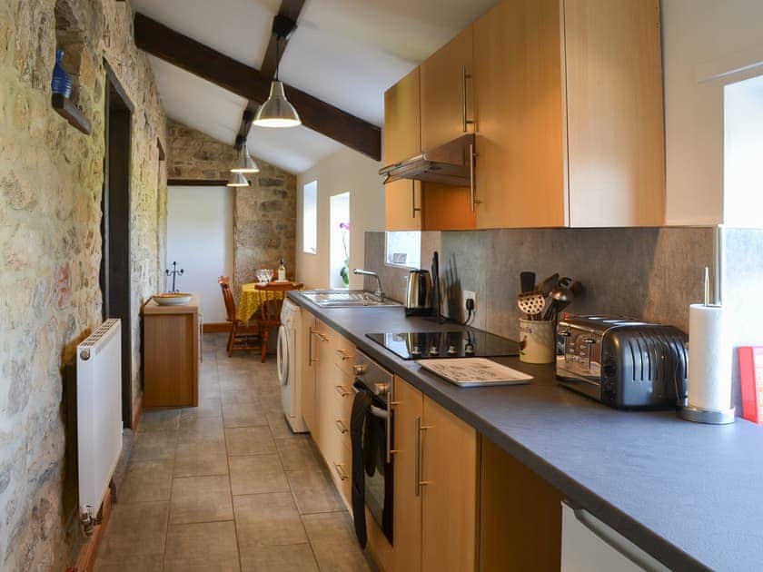 Tile-floored galley style kitchen | Mains Cottage, Belford, near Bamburgh
