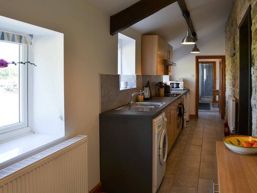 Kitchen with exposed beams | Mains Cottage, Belford, near Bamburgh