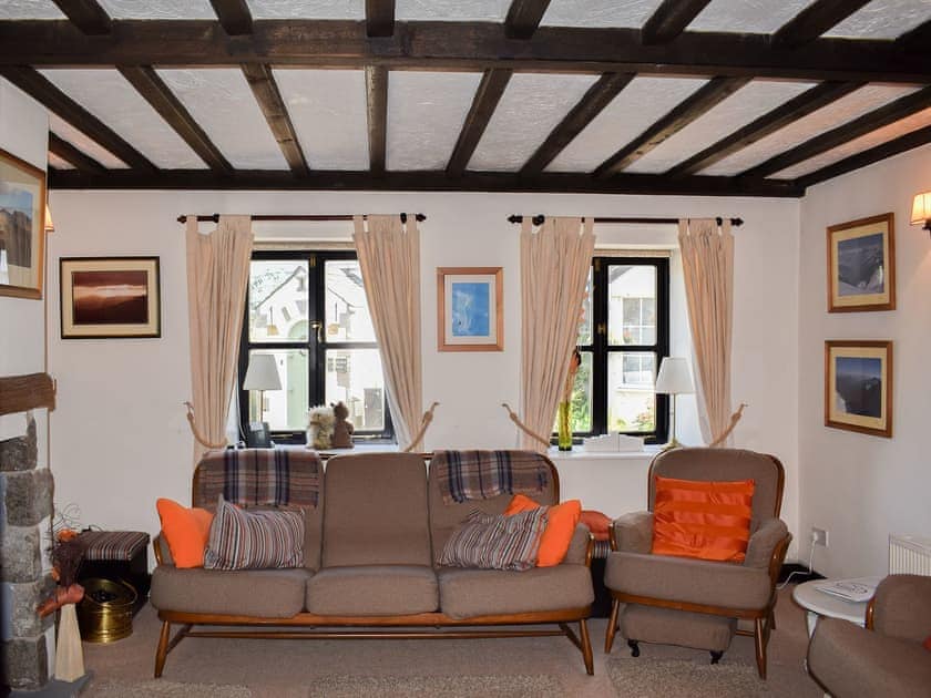 Beamed living room | River View Cottage, Bowston near Staveley