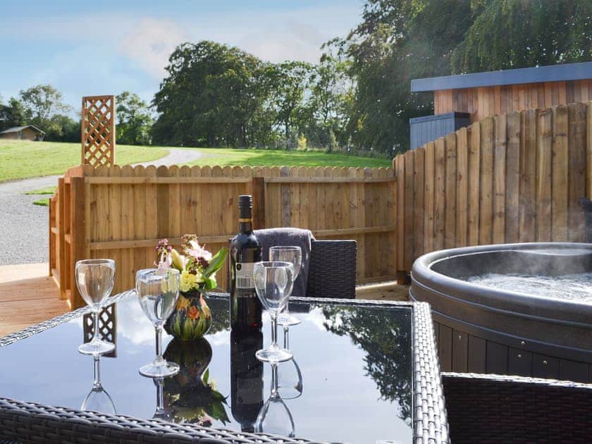 Wonderful outdoor space with private hot tub and seating area | Lapwing - Wallace Lane Farm Cottages, Brocklebank, near Caldbeck and Uldale