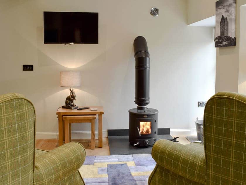 Delightful living room with wood burner | Grooms Bothy, Nenthorn, near Kelso