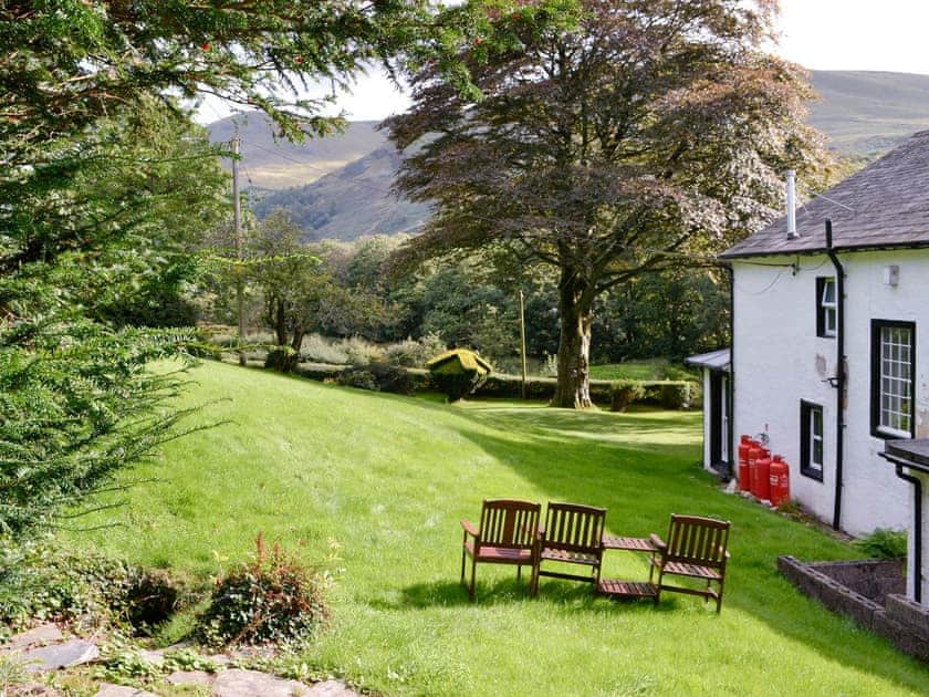 Beautiful gardens with sitting out areas | Lorna’s At The Grange - Grange Country House Holiday Cottages, Loweswater, near Cockermouth